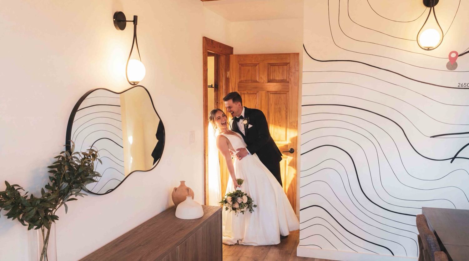 The couple laughing together inside the dome before the ceremony